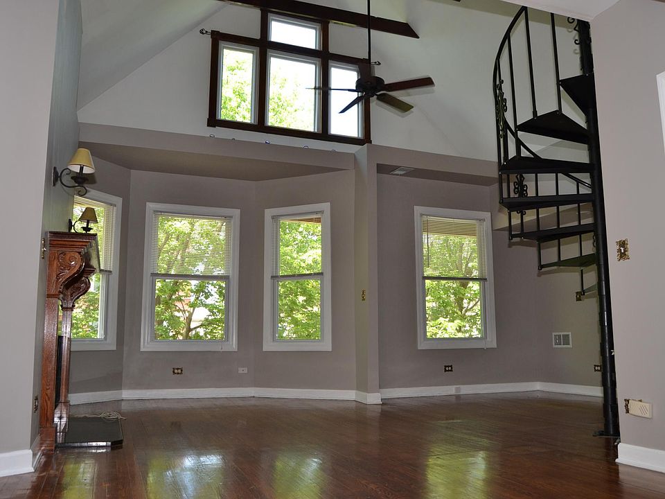 LR view from DR / Wall of Windows / Ceiling Fan / Spiral Sta