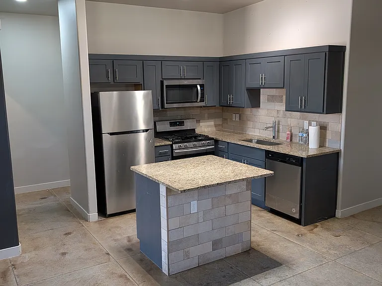 Kitchen with kitchen island and appliances
