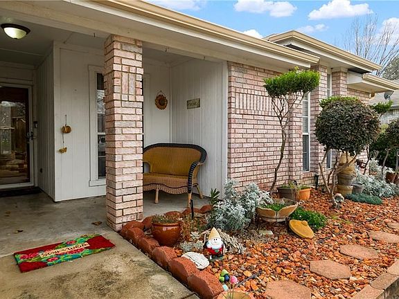 As you walk up to the home there is a covered front porch.  Landscaped front yard with sprinklers.