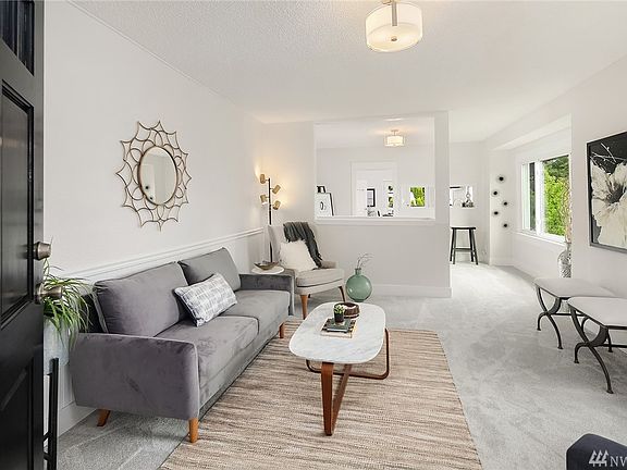 Welcome home!! Relax or entertain in this lovely living room. Ahead is the kitchen.