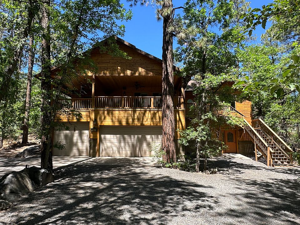 Front of house. Entrance via 3-car garage doors or upstairs. (Lower right entrance is a separate in-law unit - not included unless negotiated.)