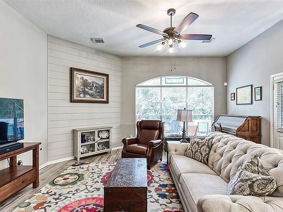 Comfy living space filled with natural light. View to backyard.