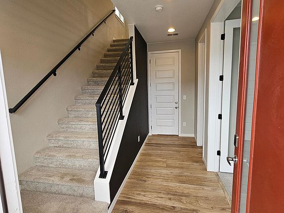 Entryway with access to Garage, Office, and storage