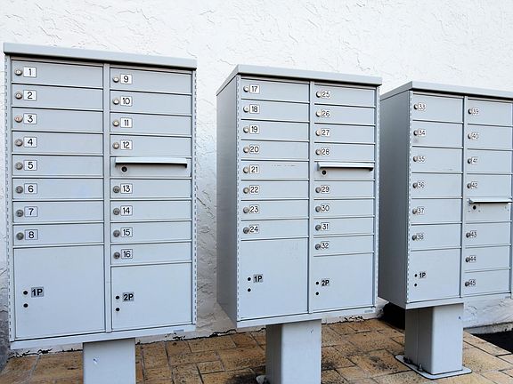 Key Locked Mail Boxes are adjacent to the Green Bell