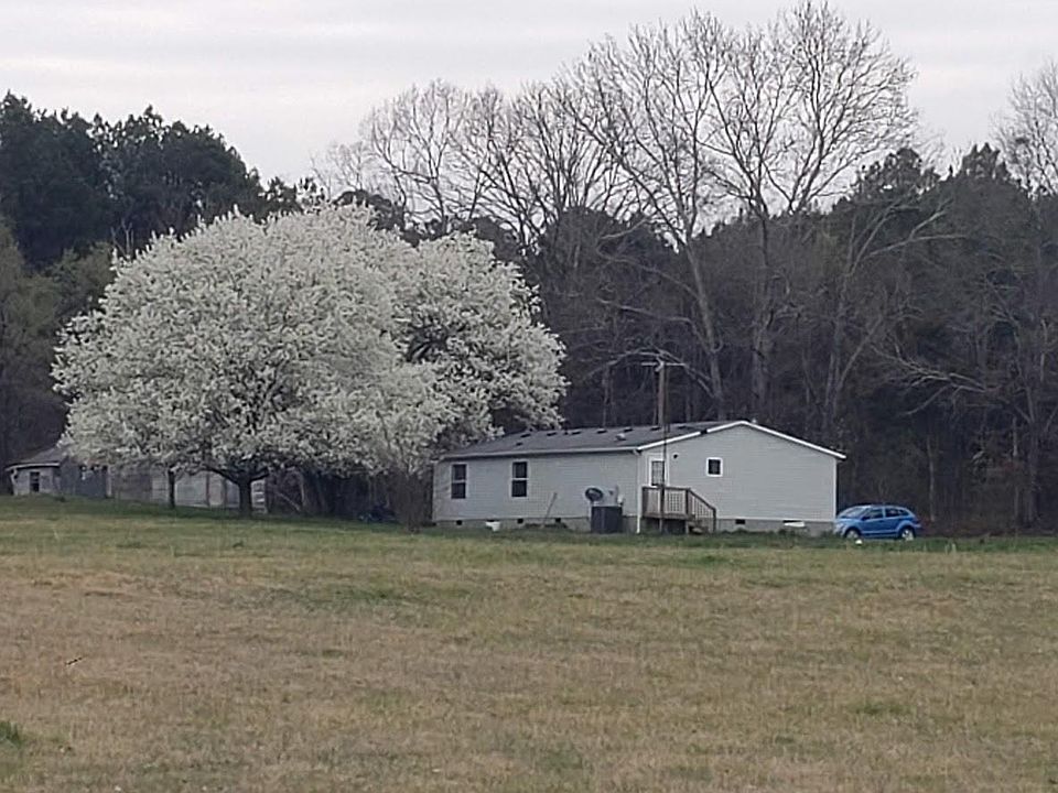View across field to back of house.