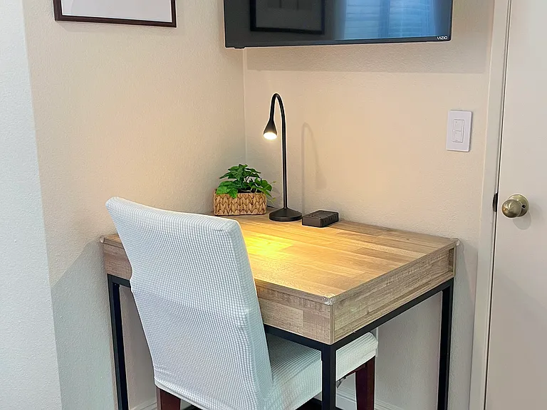 Spacious workstation with desk light, ample table space, convenient outlet, and comfy chair_ perfect for work or giving kids a dedicated homework space.