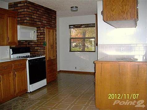 Kitchen range microwave and cabinets