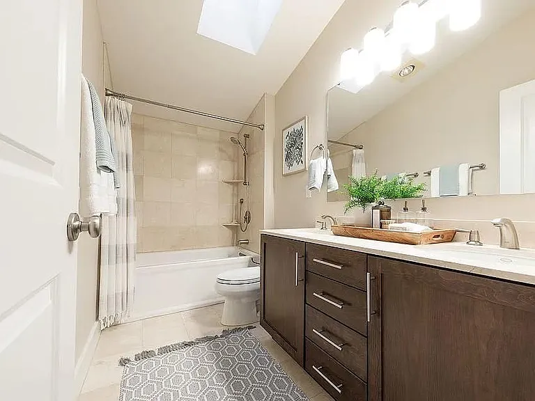 Third floor: two-sink master bathroom with sky light