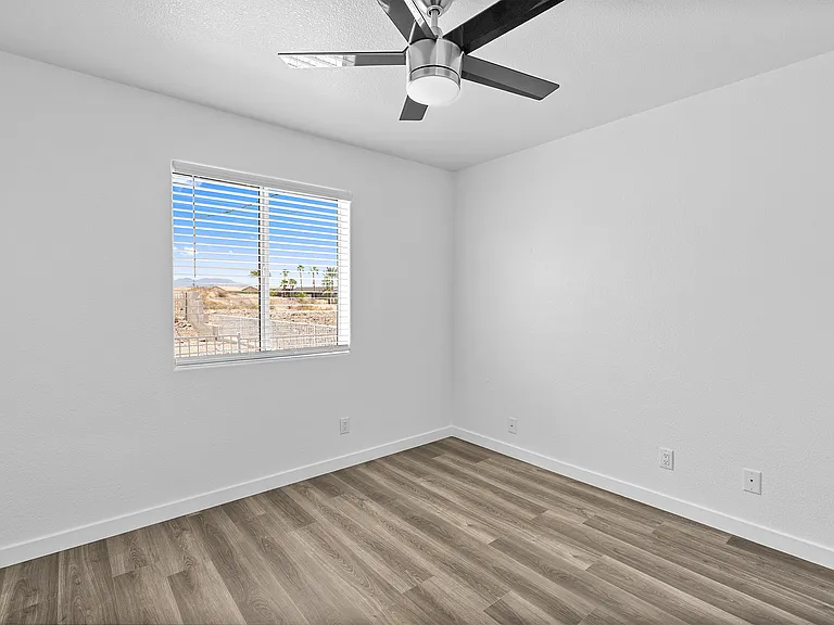 Bedroom 2; window facing backyard.