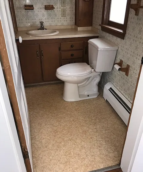 Bathroom with new toilet, flooring, and shower/tub recently installed.