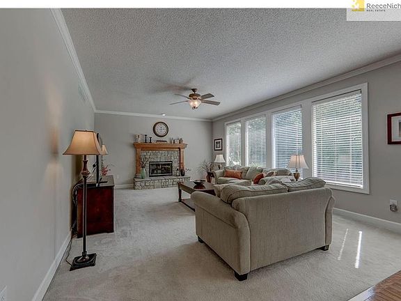 Large Windows look out to Mature Shade Trees