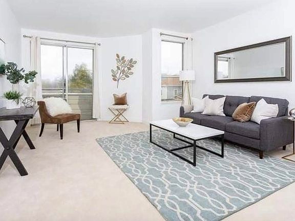 Living Room (Staged for illustrative purposes only; unit is unfurnished)