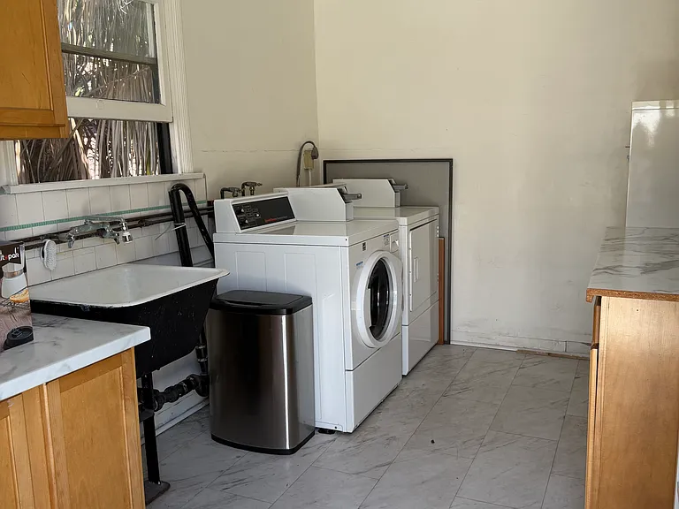 Shared laundry room which is out the back door.