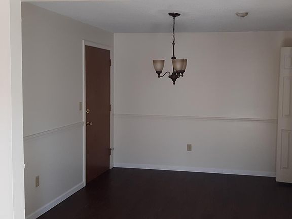 Hardwood floor dining room with pantry/closet