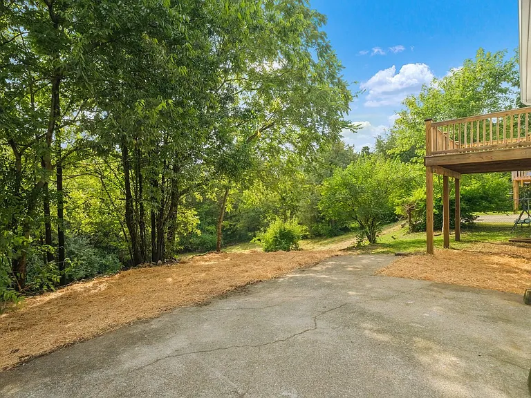 Large outdoor entertainment space including some covered area underneath the deck.
