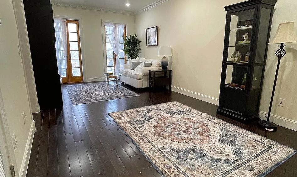 Open-Concept Living Room & Dining Space (with double French Doors leading to the spacious private Balcony and parking space below)