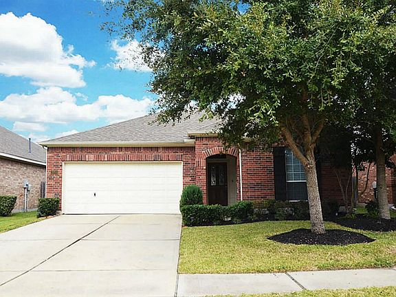 Two car garage with auto-garage door opener! Fine curb appeal with large a large shade tree.