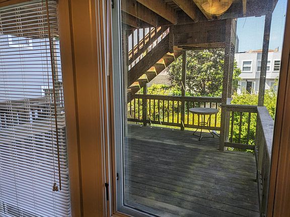 View from living room window and front door (window blind is up, window fully opens)