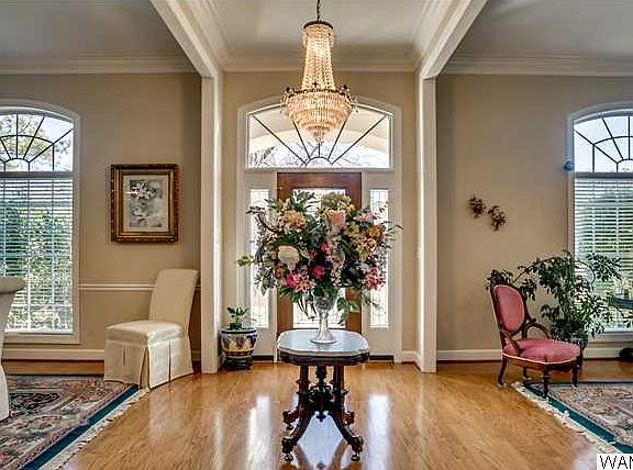 View of foyer. This lovely home offers an open floor plan, high ceilings and lots of hardwood flooring