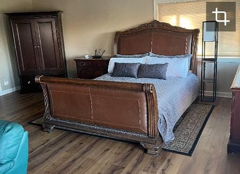 King size bed and large curio cabinet for clothing