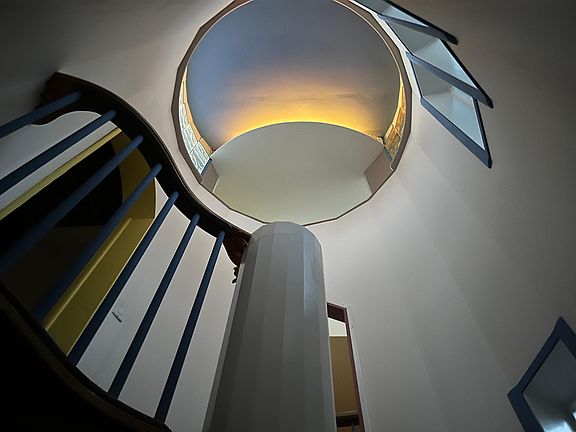 Foyer at evening. The light at the top can be different colors and intensities.
