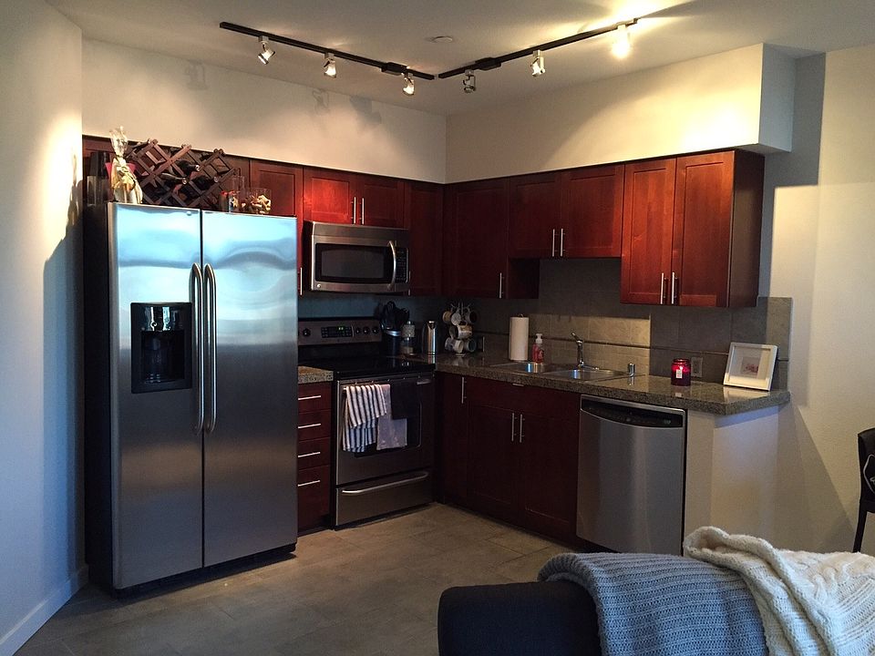 Cherry cabinets and stainless steel appliances