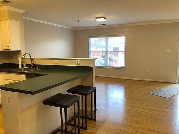 Kitchen area looking into Living room with large double window