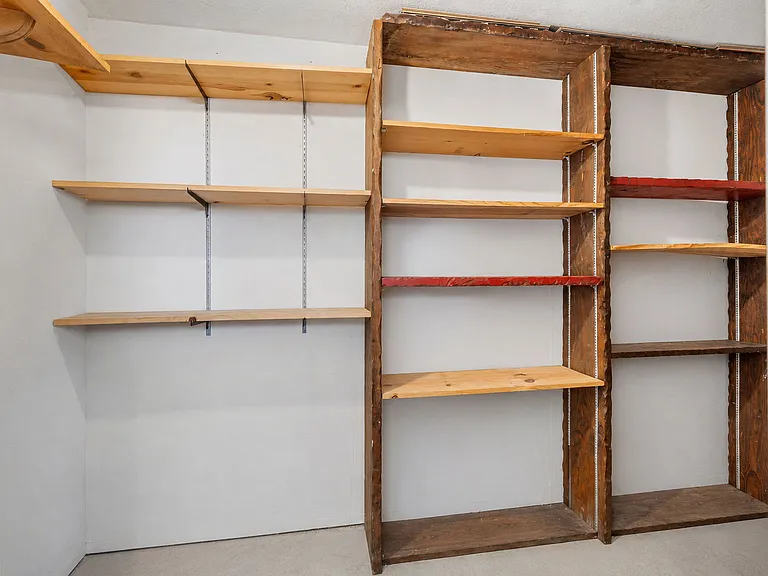 The unit includes a private storage room with direct access from the living room patio, providing convenient extra storage space.