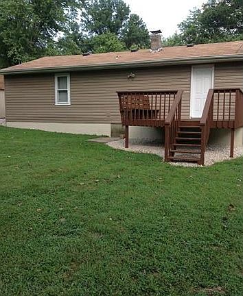 BACK VIEW OF HOME WITH NEWELY PAINTED DECK