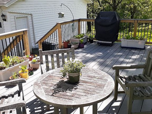 New deck with bench seating (furnishings belong to current renter)