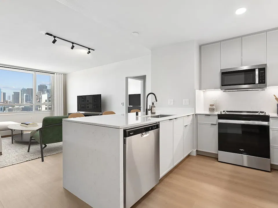 Signature Collection Phase I kitchen and living room with hard surface flooring