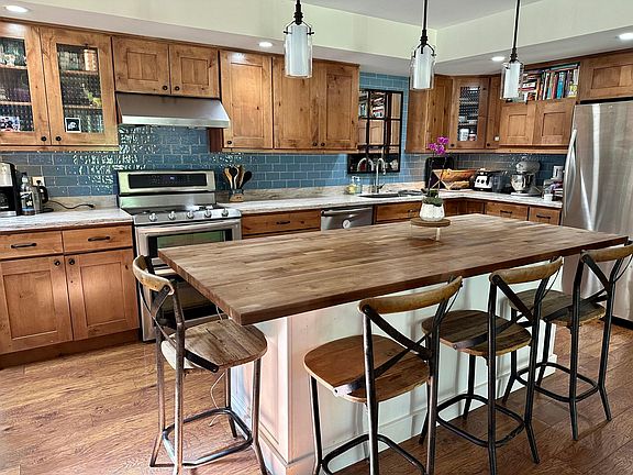 Beautiful spacious kitchen with walnut island.