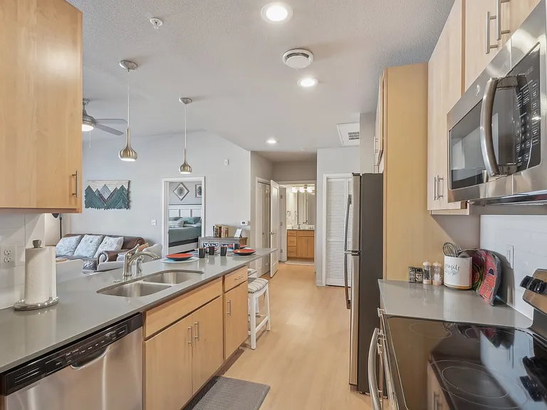 Spacious kitchen with stainless steel appliances.