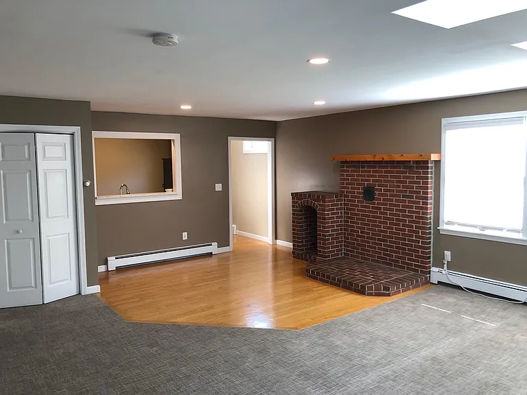 Living area looking into galley kitchen