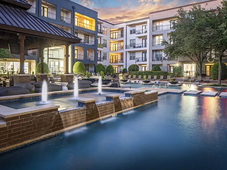 Expansive pool deck with water features