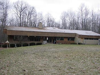 Live in a nature preserve in Saginaw Township. This contemporary family home is at the end of a longprivate drive through the woods, total site of just over 35.5 acres. Built of brick and trimmed with cedar and glass this one of a kind provides space, privacey, and a northern Saginaw Township location puts it minutes from all points in the Great Lakes Bay Region.   2012 Real Estate Taxes were estimated using 2012 Millage rates following a recent land division.