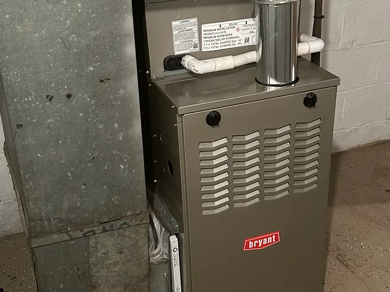 New energy efficient furnace whole house air and hot water tank. Washer and gas dryer hook ups, existing washer and dryer available if needed. Plenty of storage in basement.