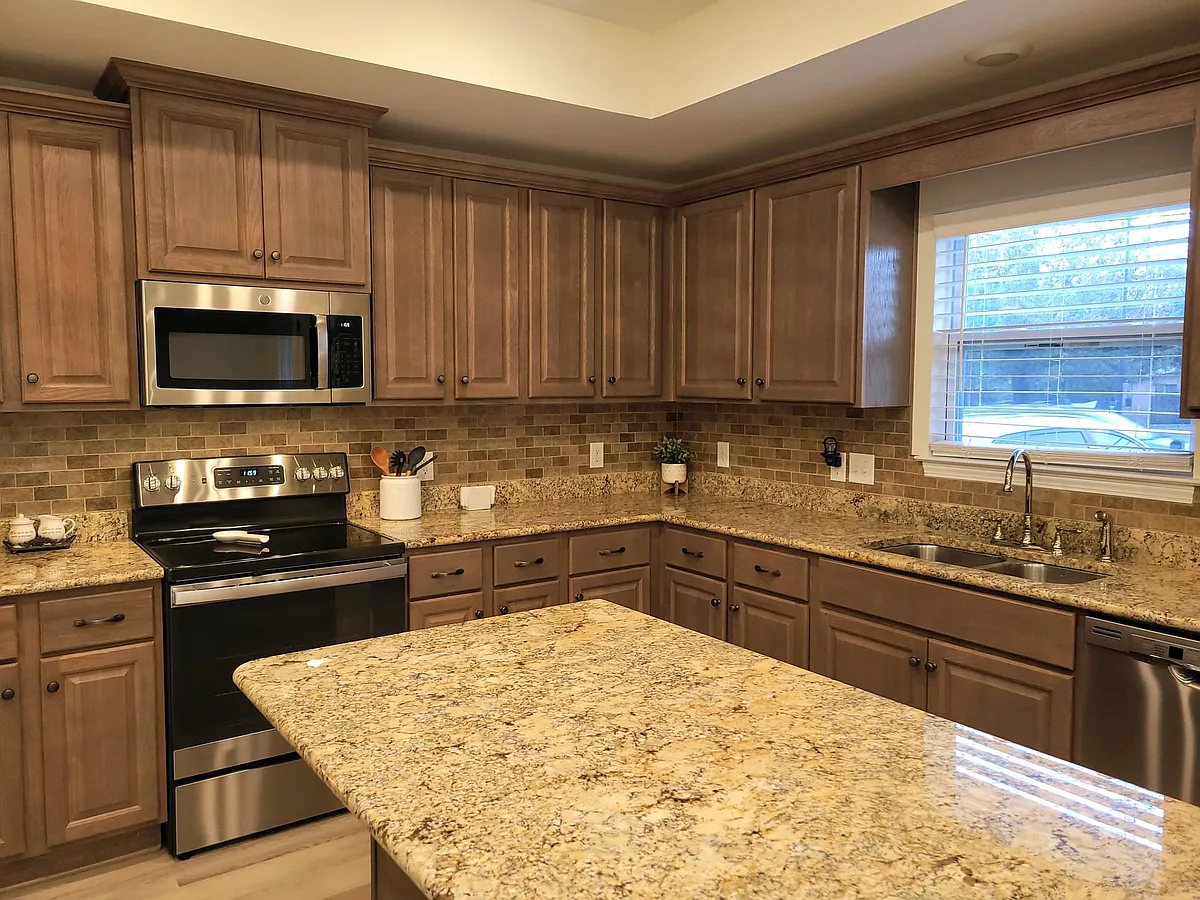 Open concept kitchen with lots of cabinet storage. - 7019 Spanish Trl