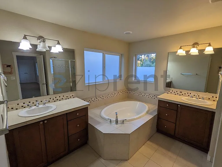 Main bath room with tub and shower