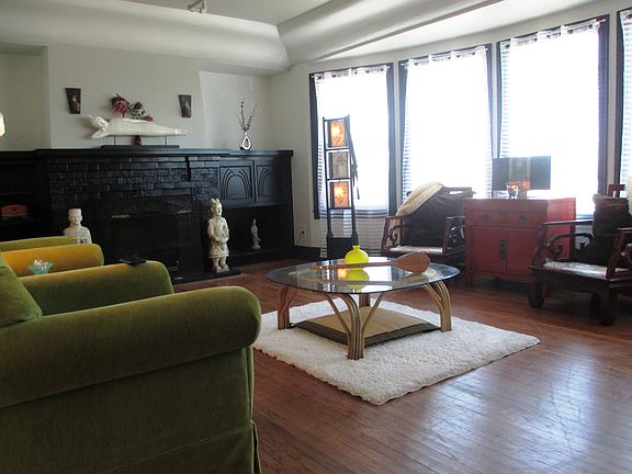 living room with views and a fireplace