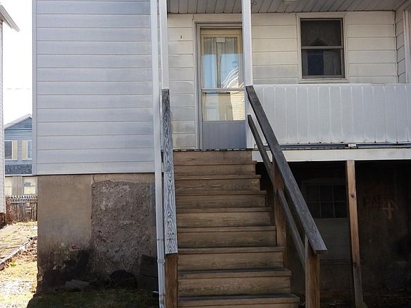 Back porch and yard. Fully fenced back yard.