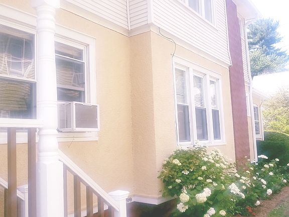 Landscaping by driveway.
