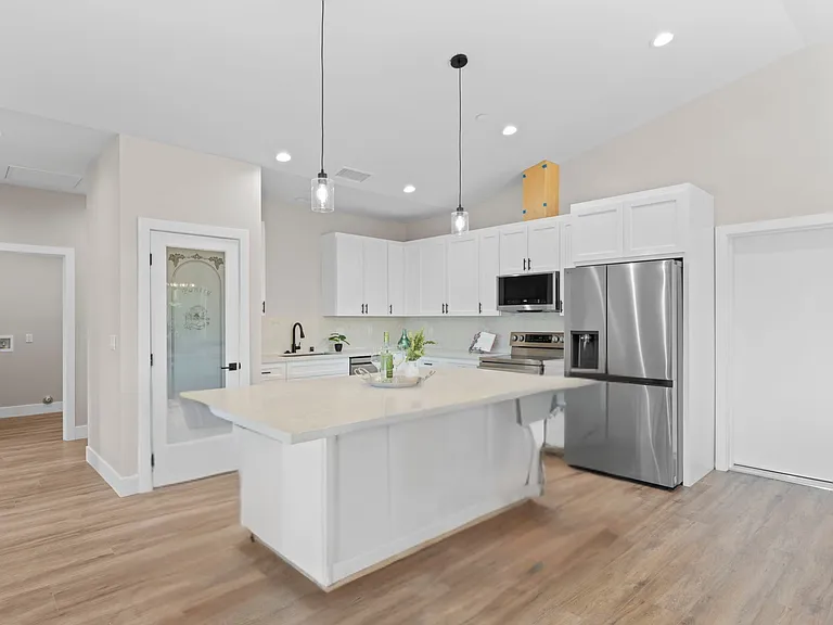 Open kitchen with breakfast bar.