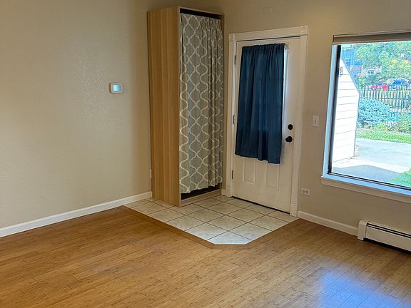 Front door with storage cabinet (perfect for coats, hats, gloves and shoes)