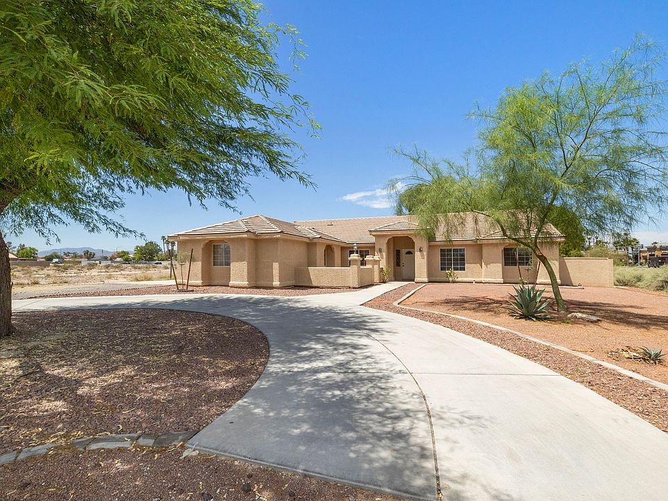 Circular Driveway out front with an adorable courtyard and mature trees for additional shade.