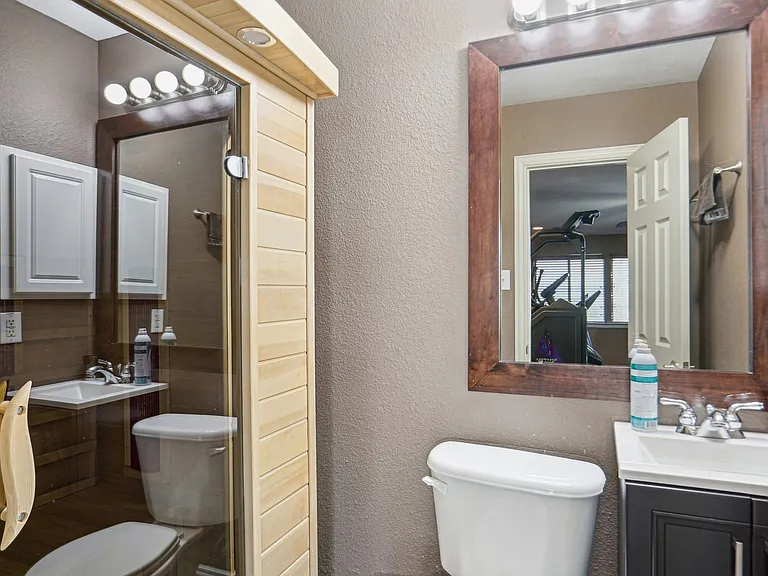 Game room or home gym with bathroom and sauna