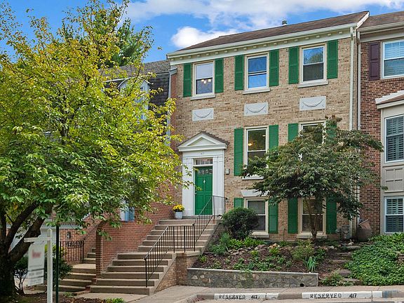 WELCOME TO YOUR ELEGANT ALL BRICK COLONIAL HOME WITH WINDOWS ON ALL 3 LEVELS
