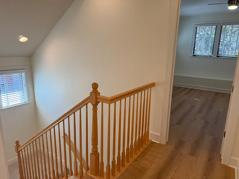 Fourth bedroom is on the third floor with a bathroom across the hallway. The fourth bedroom features a ceiling fan with 2 walk-in closets.