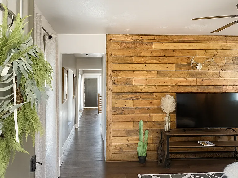 This modern rustic retreat welcomes you with a cozy entertainment nook for your favorite shows or movie nights