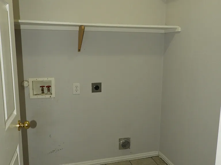 Laundry room with plenty of space for full sized W/D.
